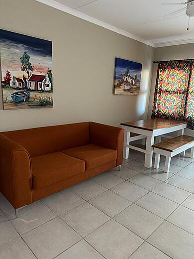 Lounge and dining table in a triple and family studio